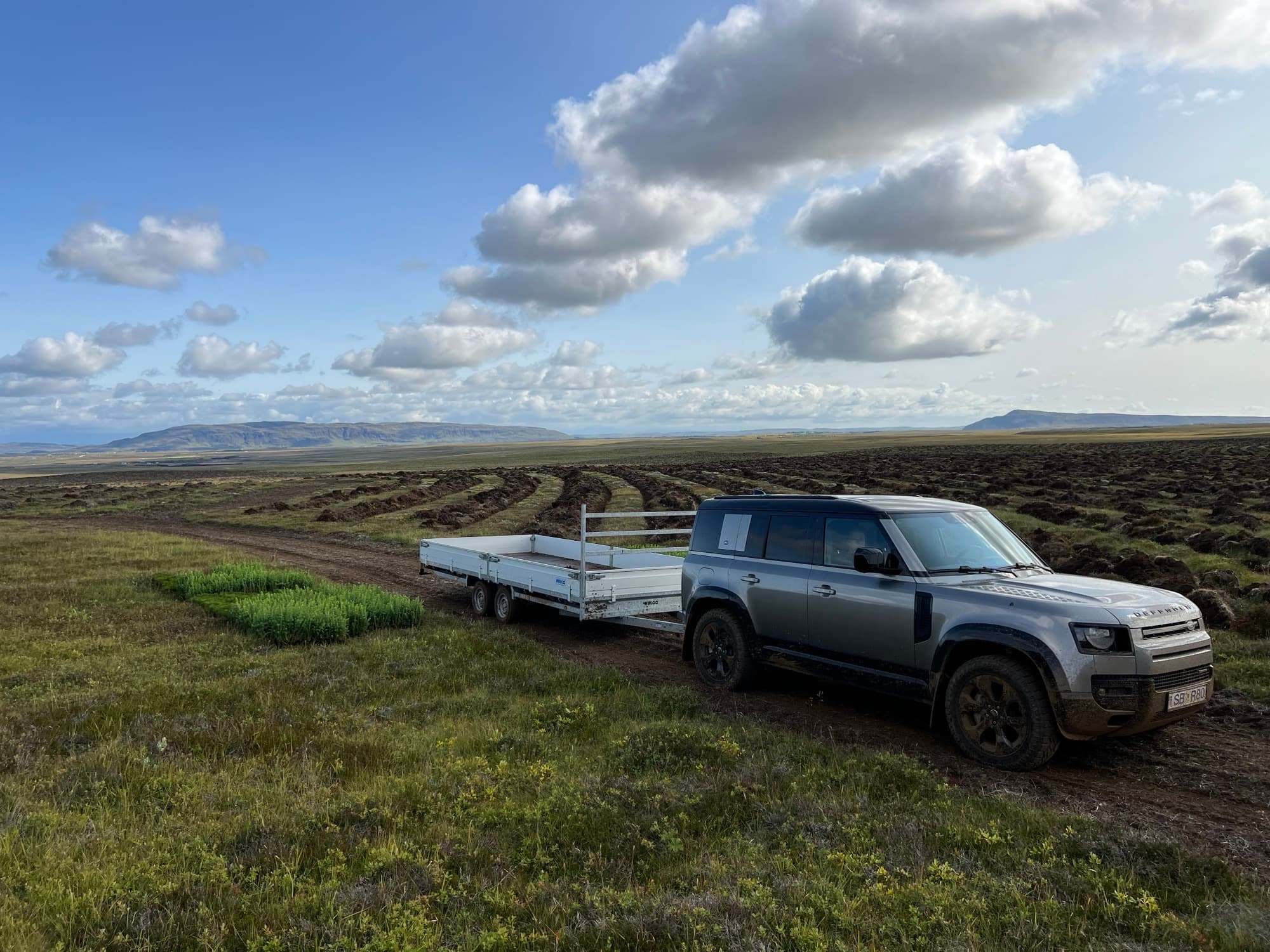 A 4×4 with a trailer of seedlings